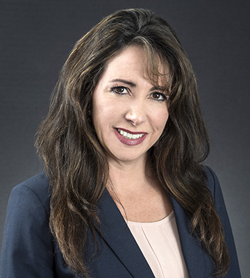 Aprilyn Chavez-Geissler speaks druing preconference workshop at NAIFA Apex